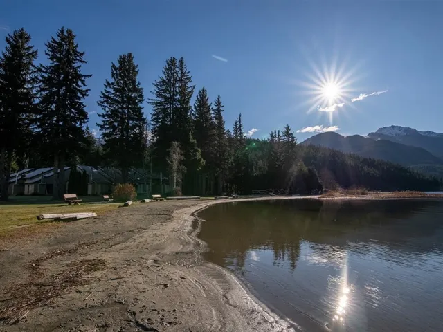 Water view featuring mountains and a heavily wooded area