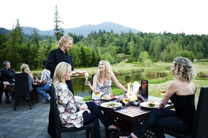 View of property's community featuring a wooded view, a mountain view, and a patio