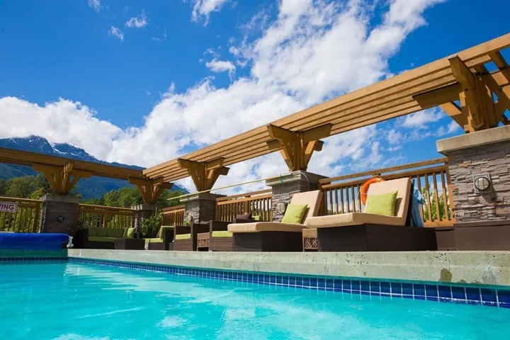 View of swimming pool featuring an outdoor living space and a covered pool
