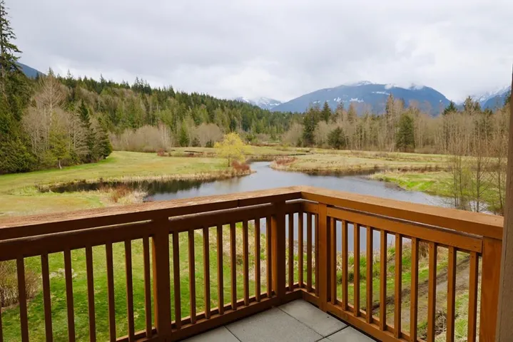Deck featuring a water and mountain view and a forest view