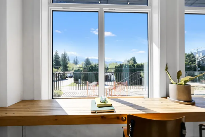 Expansive window wall with white framing and multiple panes