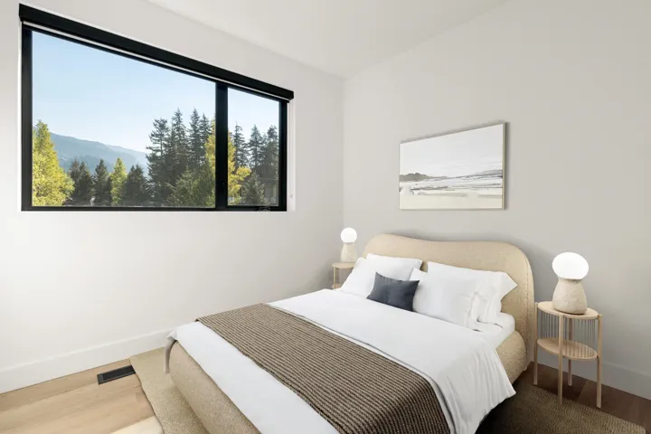 Bedroom with wood finished floors and baseboards