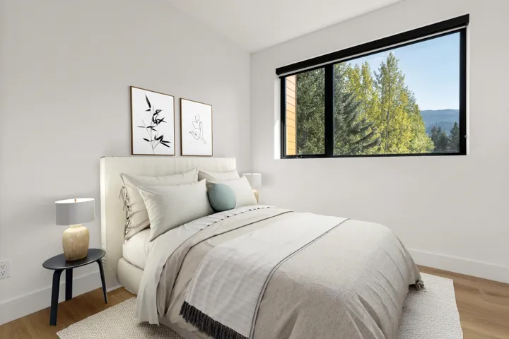 Bedroom featuring wood finished floors and baseboards
