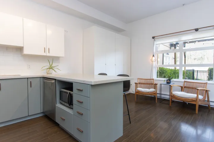 Open concept kitchen with the living room and dining room on main level.