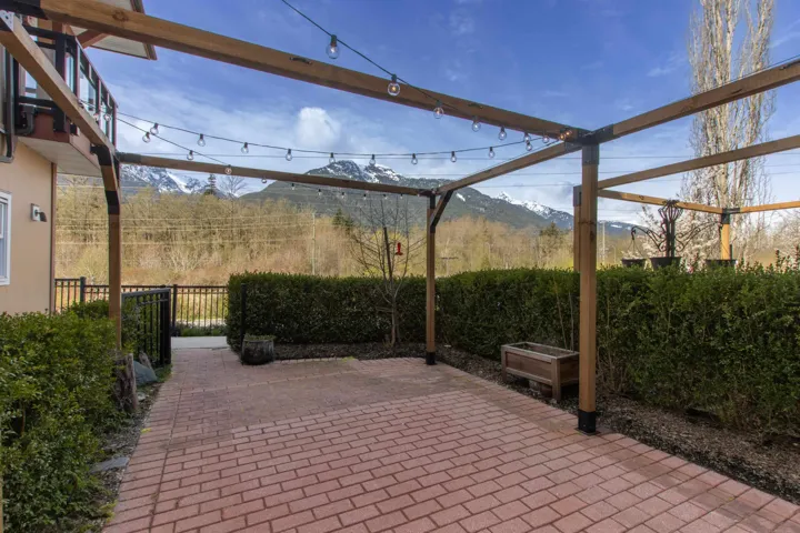 View of patio / terrace with a mountain view and a pergola that comes with sun shades that creates a wonderful outdoor space.
