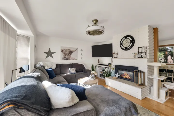 Living room featuring a fireplace and wood finished floors