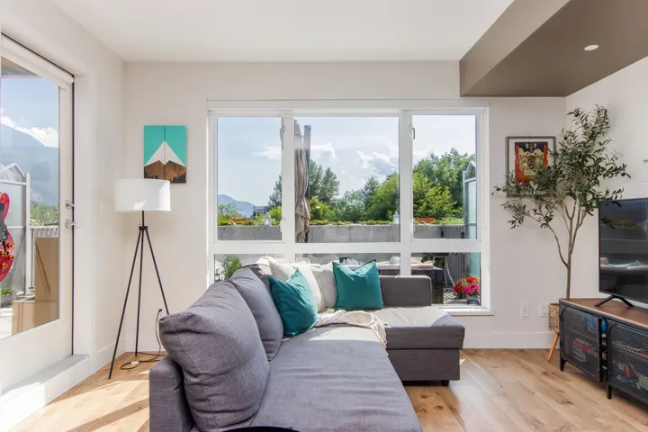 Living area featuring light wood-style floors and recessed lighting
