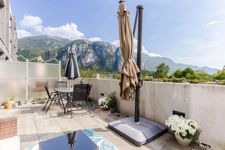 View of patio featuring outdoor dining area and a mountain view