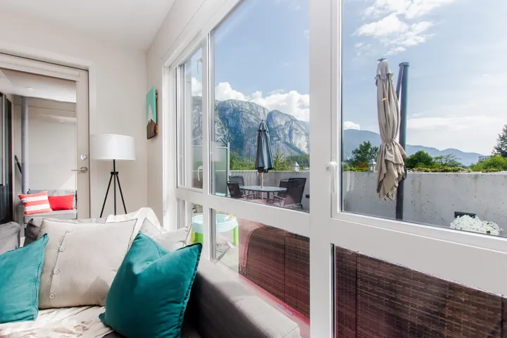 Sunroom with a mountain view