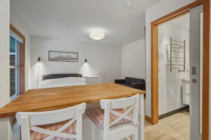 Bedroom featuring light wood-style floors and baseboards