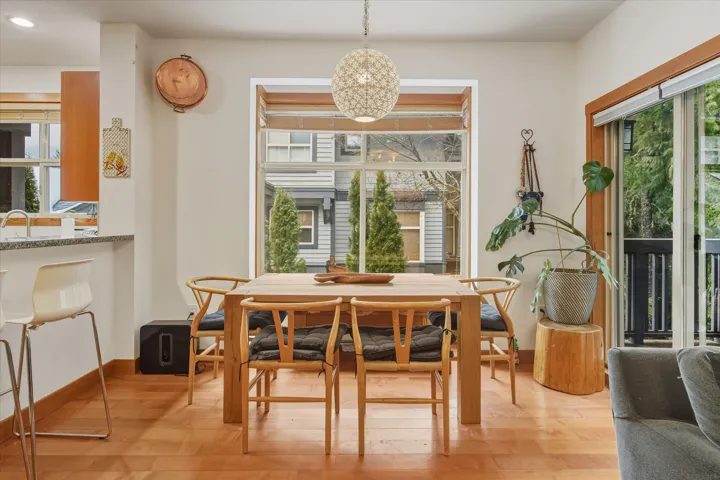 Dining room featuring light wood finished floors and baseboards