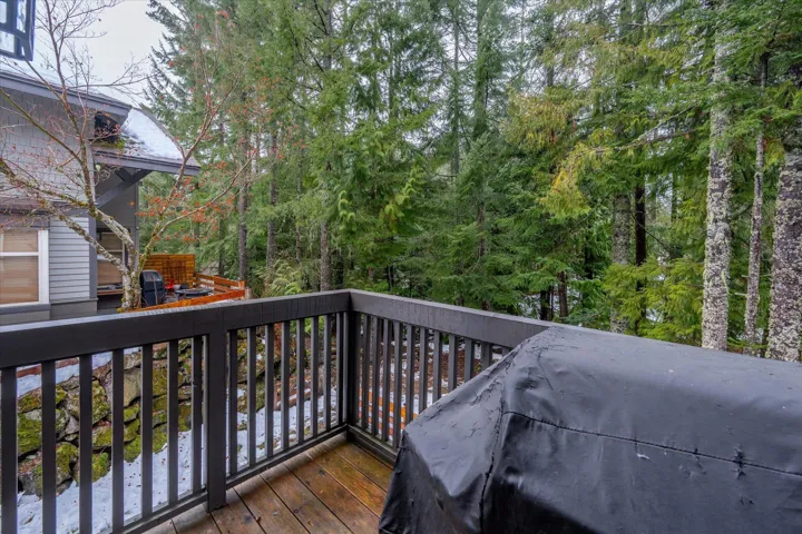 Wooden terrace featuring grilling area