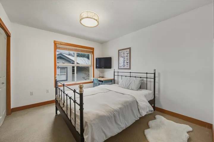 Bedroom with carpet floors and a closet