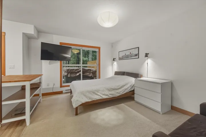 Bedroom with baseboards and baseboard heating