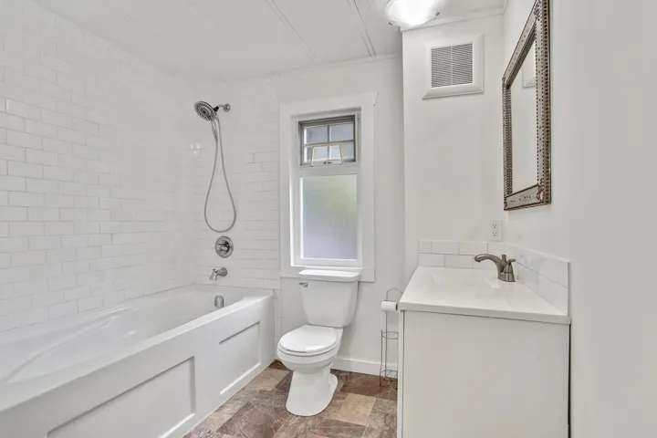 Full bath with shower / tub combination and vanity