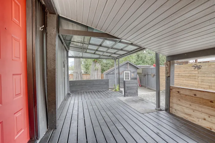 Wooden terrace with a storage shed