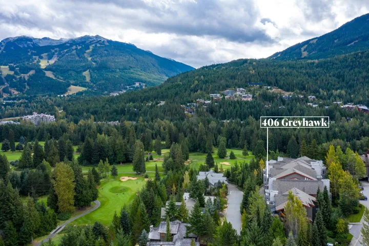 Exterior space featuring a forest view and a mountain view