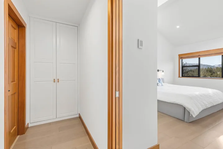 Hallway with baseboards and light wood-style floors