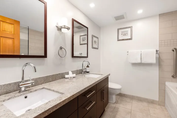 Full bath with a sink, visible vents, toilet, and tile patterned floors