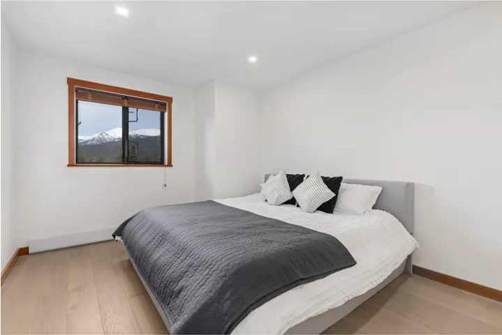 Bedroom featuring light wood-type flooring, baseboards, and recessed lighting
