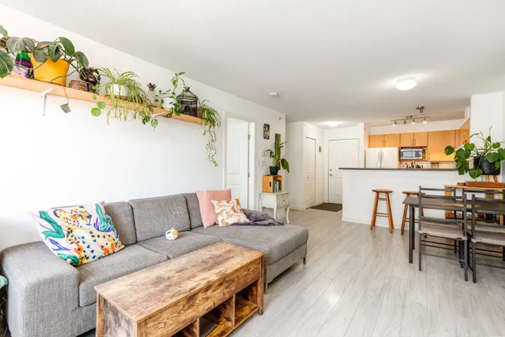 Open-concept living space featuring light wood-finish flooring throughout
