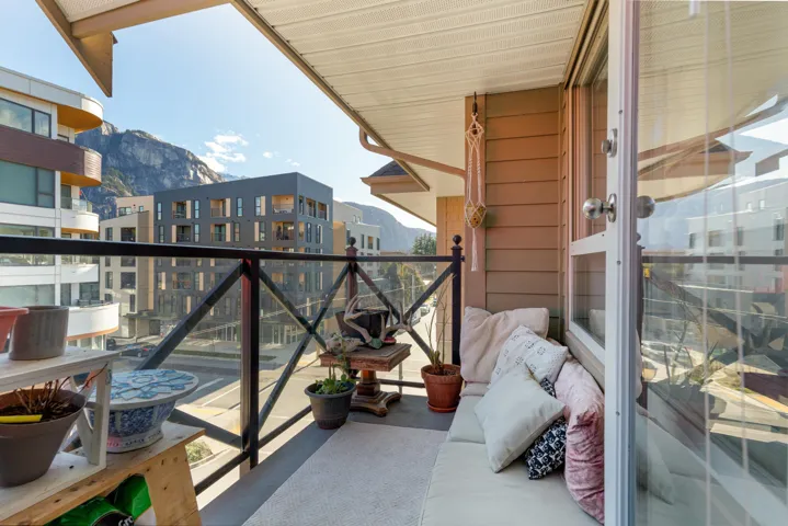 Balcony with glass railing and durable concrete flooring