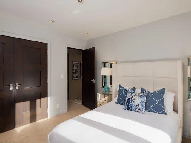 Bedroom featuring light colored carpet, a closet, and recessed lighting