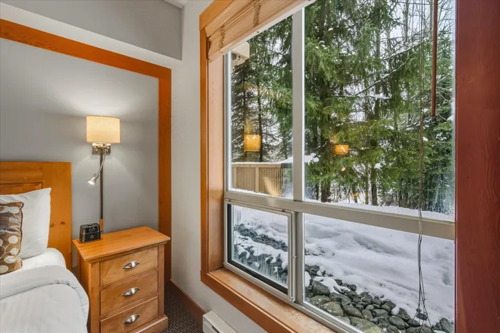 Bedroom featuring a baseboard heating unit