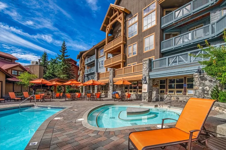 Community pool with a patio