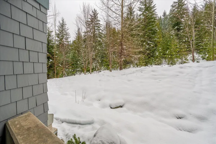 View of yard layered in snow