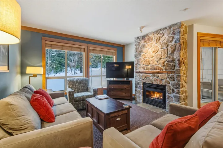 Living area with a stone fireplace