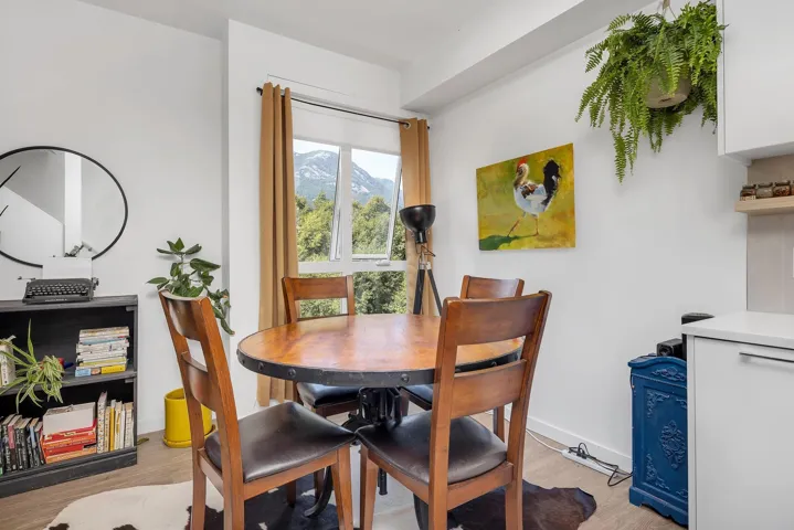 Dining room featuring light wood finished floors and baseboards