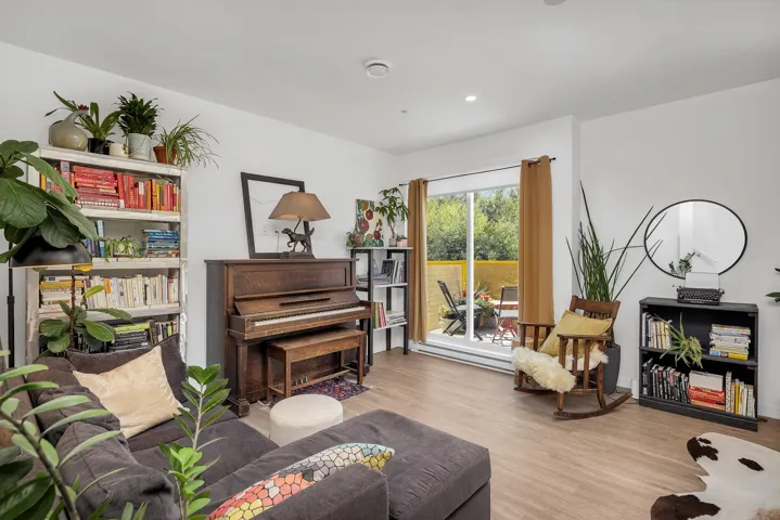 Sitting room with light wood-style floors and recessed lighting