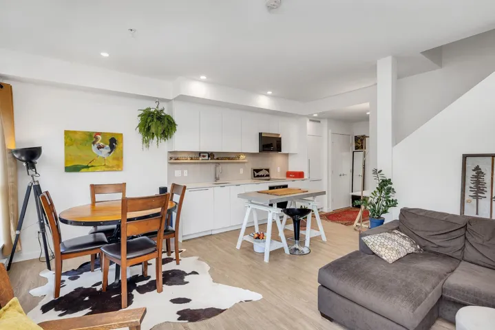 Living room featuring light wood finished floors and recessed lighting