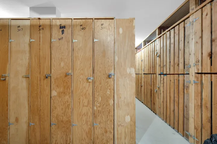Dedicated storage units featuring natural wood construction and individual locking mechanisms