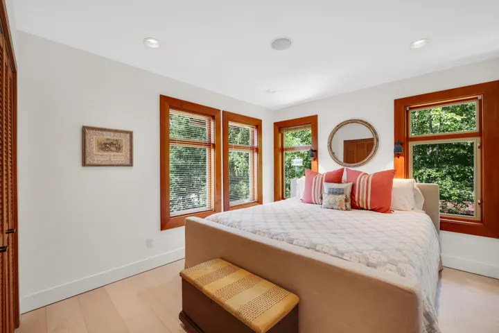 Bright room featuring light wood-finish flooring and white walls