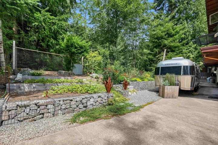 Terraced garden beds featuring gabion walls and integrated landscaping