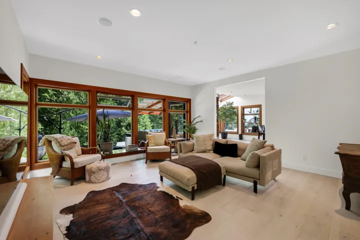 Light wood-finish flooring throughout, complemented by recessed ceiling lighting