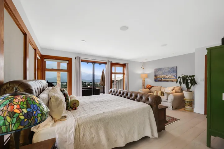 Bright room featuring light wood-finish flooring and white walls