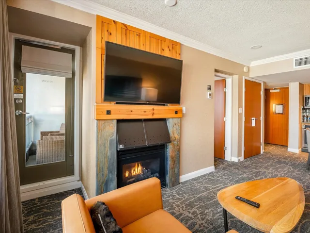 Kitchen featuring backsplash, light brown cabinets, stainless steel appliances, and a sink