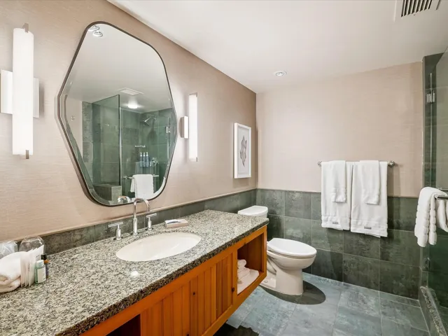 Living area with a fireplace, crown molding, a textured ceiling, and baseboards