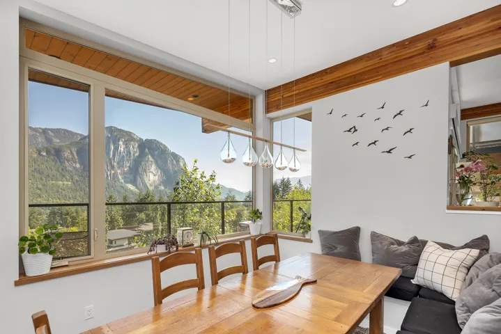 Sunroom with a mountain view
