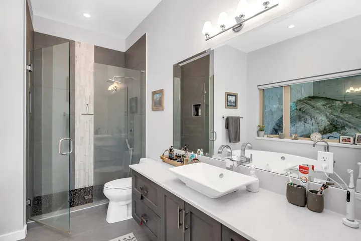 Full bath with vanity, a shower stall, recessed lighting, and tile patterned flooring