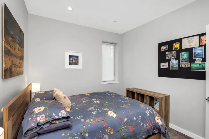 Carpeted bedroom with baseboards and recessed lighting
