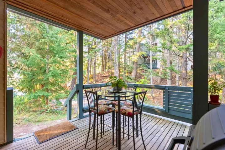 Wooden terrace with outdoor dining area