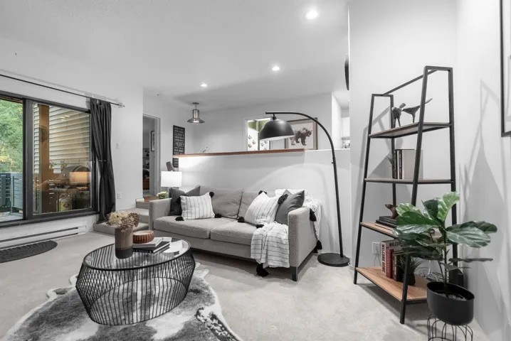 Carpeted living room featuring recessed lighting and healthy amount of natural light