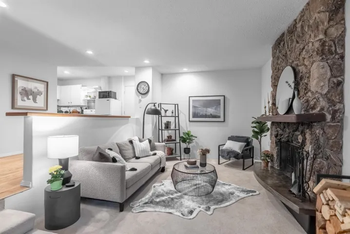 Living area featuring a fireplace and recessed lighting