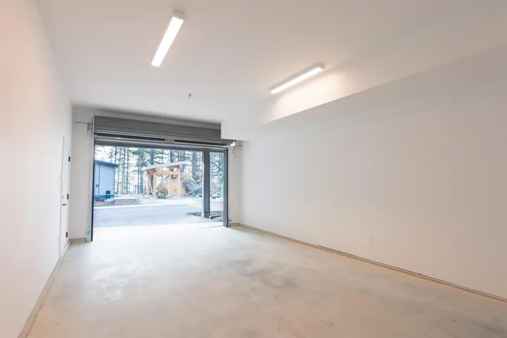 Garage featuring baseboards