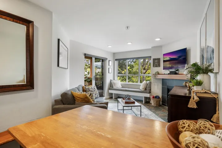Living room featuring a tile fireplace and recessed lighting