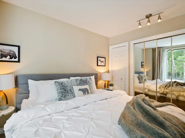 Bedroom with a closet and track lighting